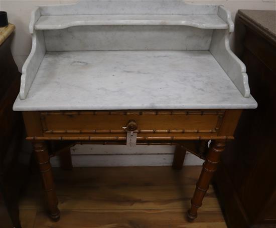 A Victorian pine faux bamboo marble top washstand W.79cm